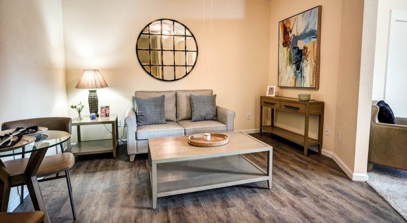 Furnished Living Room with Sofa and Coffee Table at Assisted Living Facility