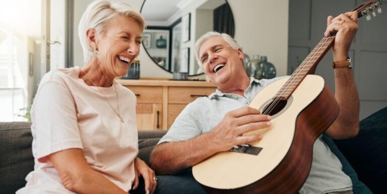 Elderly Couple Singing and Playing Guitar at Memory Care Facility