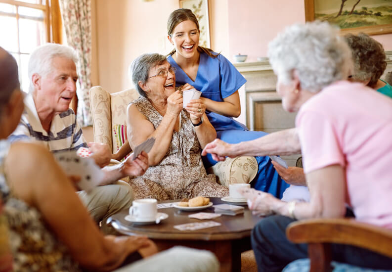 Seniors Enjoying Card Games on a Sunny Day at an Assisted Living Facility Seniors Enjoying Card Games on a Sunny Day at an Assisted Living Facility